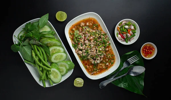 Northeastern Thailand\'s food, spicy minced pork salad(Larb Moo) is spicy and hot. Serve with fresh vegetables top view