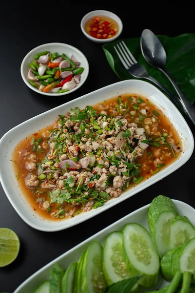 Northeastern Thailand\'s food, spicy minced pork salad(Larb Moo) is spicy and hot. Serve with fresh vegetables