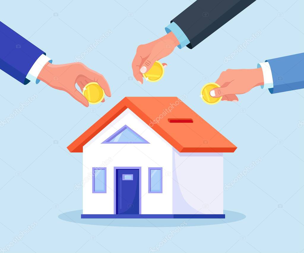 Human hands put coins in home is like a piggy bank. Tiny people buying house in debt. People investing money in property. Mortgage loan, ownership and savings. Real estate investment, house purchase