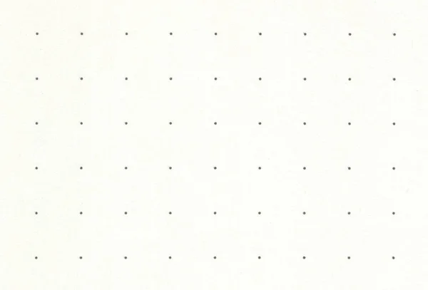 Blanco gestippelde lichtgele notebook papier achtergrond. — Stockfoto