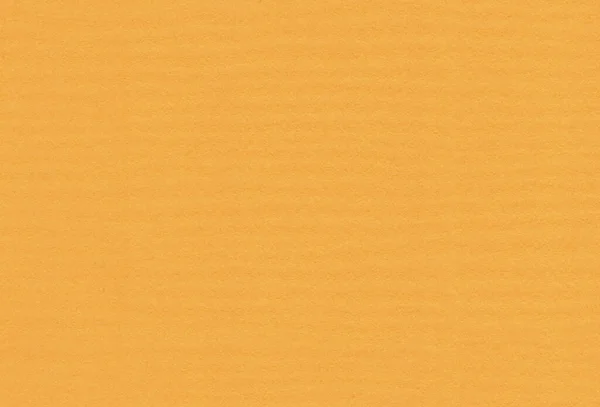 Close-up blik van getextureerde helder oranje gekleurde creatieve papieren achtergrond. — Stockfoto