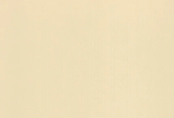Текстурированный светло-желтый цветной бумажный фон. — стоковое фото