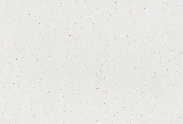 Geri dönüştürülmüş kağıdın arka planında küçük doğal lifler var.. 