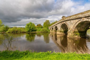 Atcham Old Bridge over the River Severn in Atcham, near Shrewsbury, Shropshire, England, UK clipart