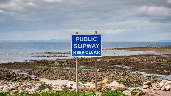 Sign: Public Slipway, Keep Clear - seen in Parton Beach, Cumbria, England, UK