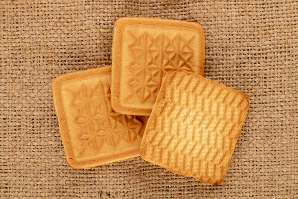 Three Sugar Cookies Jute Fabric Macro Top View — Stock Photo, Image