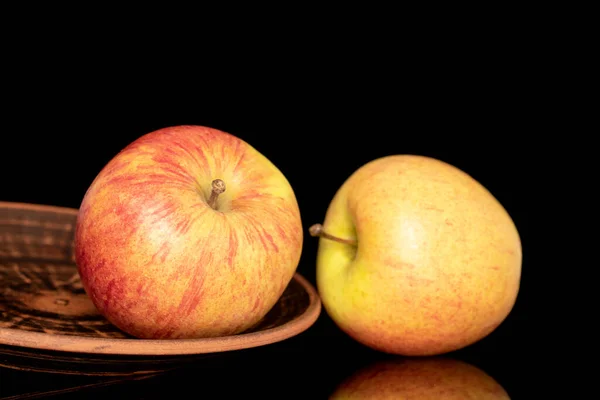 Two Sweet Ripe Apples Clay Plate Close Isolated Black Background — Stockfoto