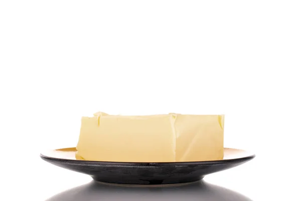 Один Кусочек Вкусного Масла Керамической Пластины Крупным Планом Изолированные Белом — стоковое фото