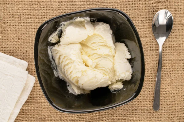 Several Scoops White Ice Cream Black Ceramic Dish Jute Cloth — Foto Stock