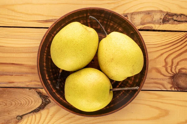 Three Sweet Bright Yellow Pears Ceramic Plate Wooden Table Close — ストック写真