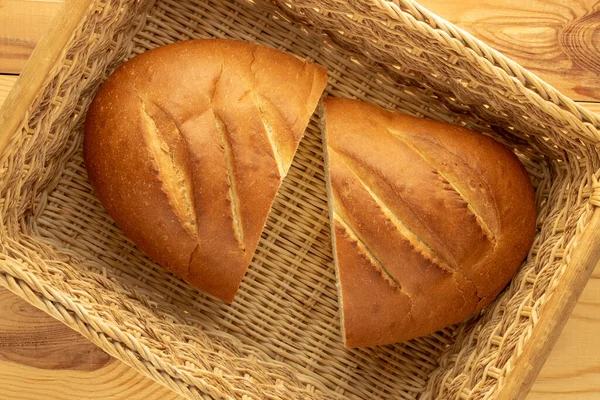 Two Halves Fragrant Fresh Long Loaf Straw Basket Wooden Table — Stok fotoğraf