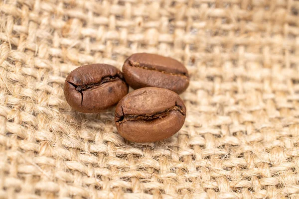 Three Coffee Beans Jute Fabric — Stock Photo, Image