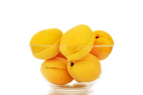 Several Bright Yellow Juicy Pineapple Apricots Glass Bowl Macro Isolated — Foto Stock