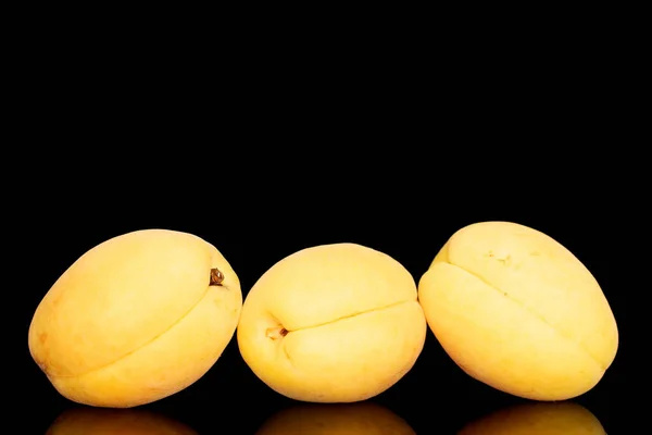 Three Bright Yellow Juicy Pineapple Apricots Macro Isolated Black Background — Fotografia de Stock