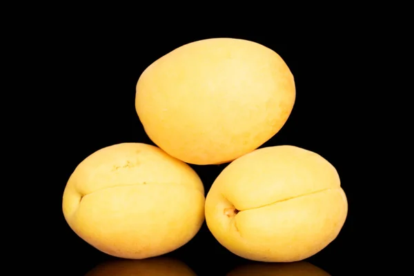 Three Bright Yellow Juicy Pineapple Apricots Macro Isolated Black Background — Fotografia de Stock