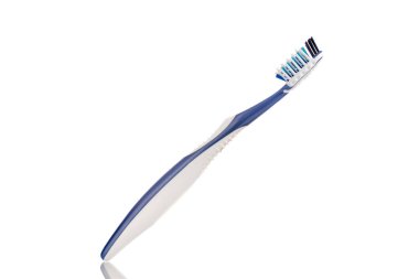 One plastic toothbrush, close-up, isolated on a white background.