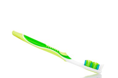 One plastic toothbrush, close-up, isolated on a white background.