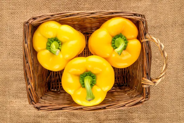 Three Ripe Yellow Sweet Peppers Basket Jute Fabric Close Top — Stockfoto