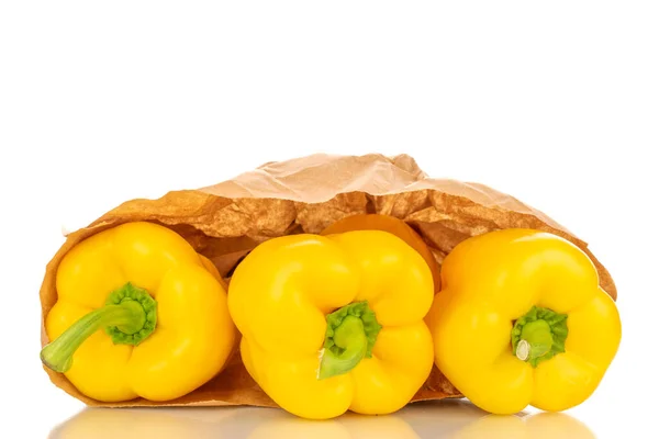 Three Sweet Peppers Bright Yellow Color Paper Bag Macro Isolated — Φωτογραφία Αρχείου