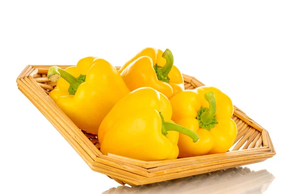 Four Sweet Peppers Bright Yellow Color Straw Tray Macro Isolated — стоковое фото