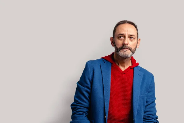 Portrait of sexy mature grey bearded man. Stylish bearded senior bearded man looking away from camera isolated on grey background. — Stock Photo, Image