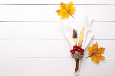 Autumn table setting on white wooden table Thanksgiving or Octoberfest vintage background copy space