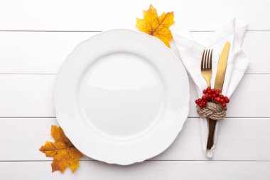 Autumn table setting on white wooden table Thanksgiving or Octoberfest vintage background copy space