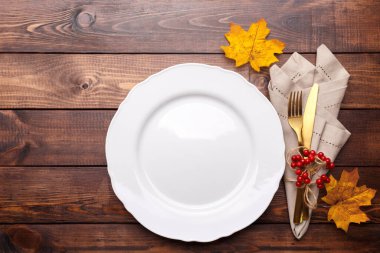 Autumn table setting on old wooden table Thanksgiving or Octoberfest vintage background copy space