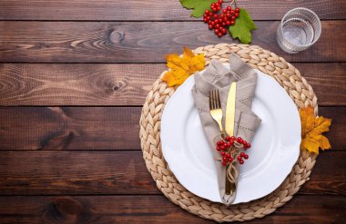 Autumn table setting on old wooden table Thanksgiving or Octoberfest vintage background copy space