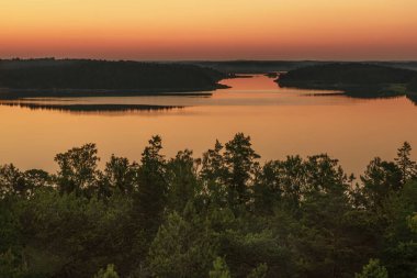 Early, summer dawn, over the sea. Nature of Scandinavia. Islands in the sea. Finland.