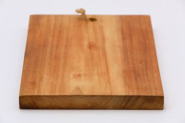 Closeup wooden cutting board isolated on white background