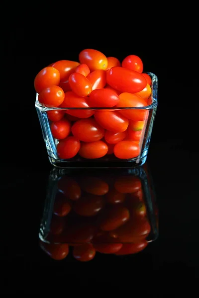 Fresh Small Red Tomatoes Glass Cup Dark Background Reflex — Stock Photo, Image