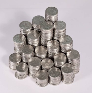 A pile of Thailand one baht coins is placed unequally in height. View from above