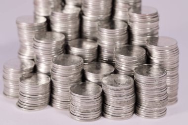 A pile of Thailand one baht coins is placed unequally in height. View from above