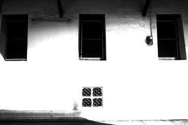 Windows of The monk's residence at Wat Thepthidaram Worawihan, built during the reign of Rama III, Rattanakosin, Bangkok, Thailand,Black and white