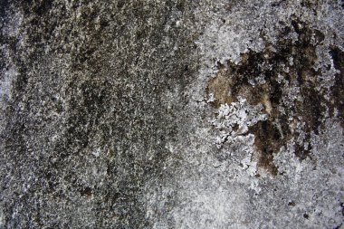 The old walls have plastered cracks that have been eroded by water and wind for a long time. 