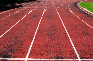Outdoor athletics stadium constructed from synthetic rubber