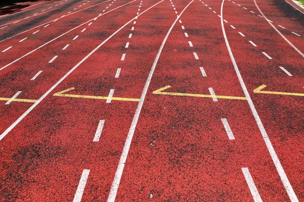 Outdoor athletics stadium constructed from synthetic rubber