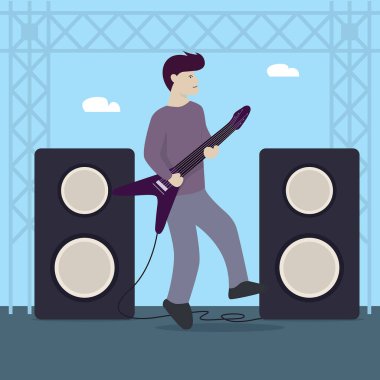 Gitar elektiriğiyle müzik çalan adam