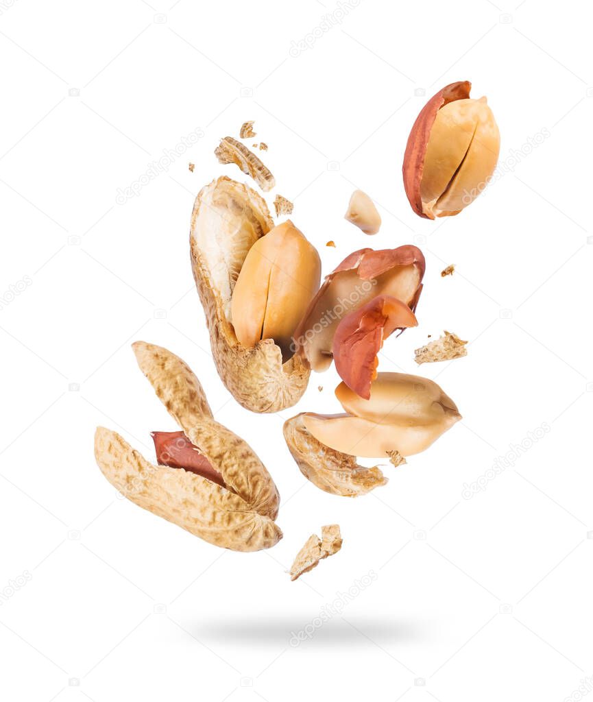 Crushed peanuts are flying in different directions in the air