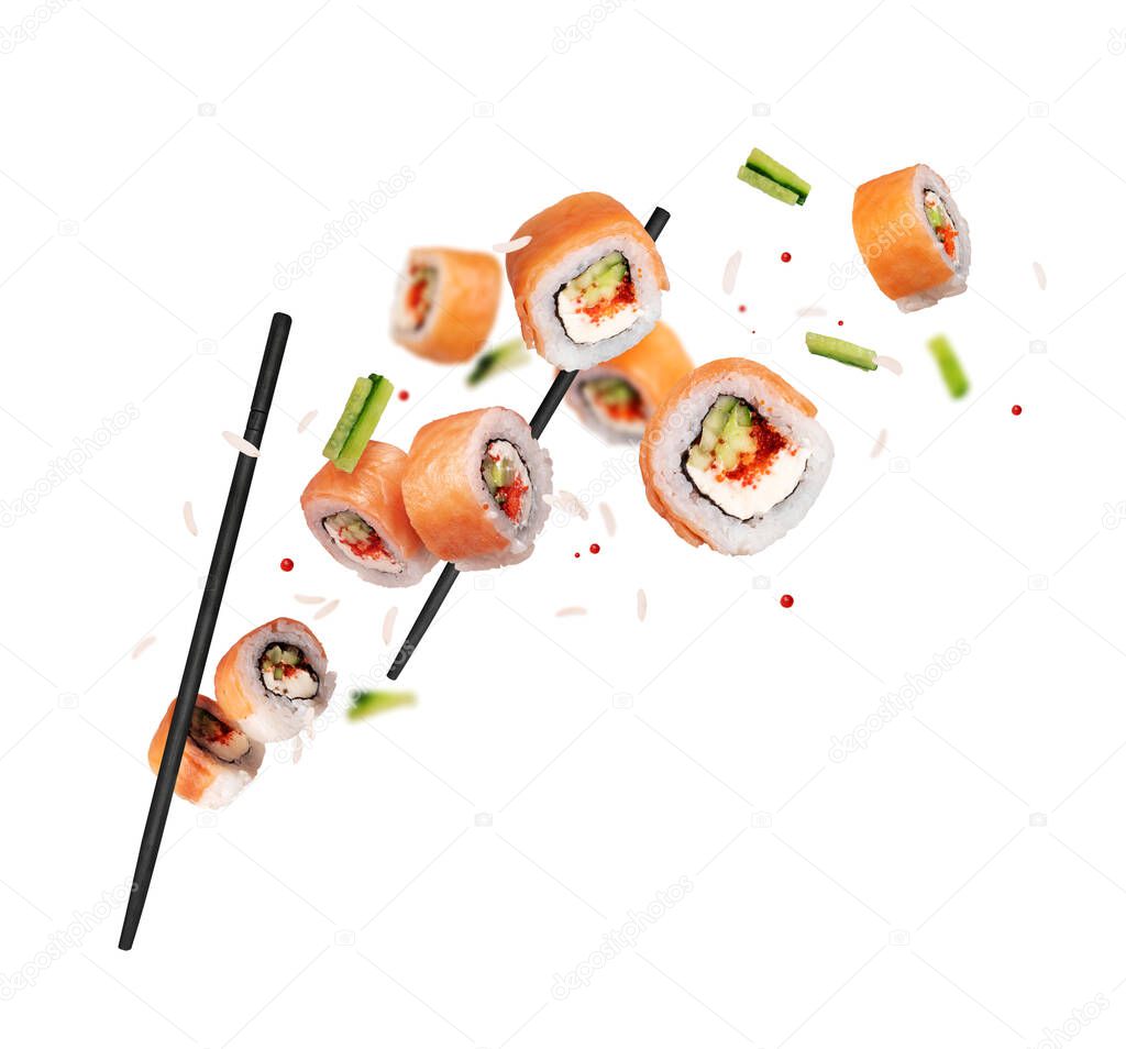 Fresh sushi with salmon and ingredients in the air isolated on a white background