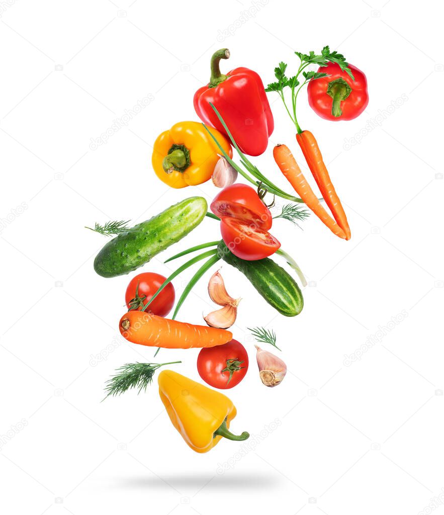 Various vegetables in the air on a white background 
