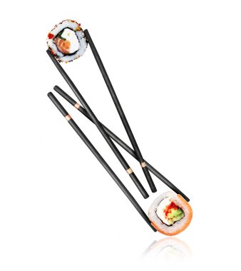 Two various sushi rolls sandwiched between sticks close-up on a white background