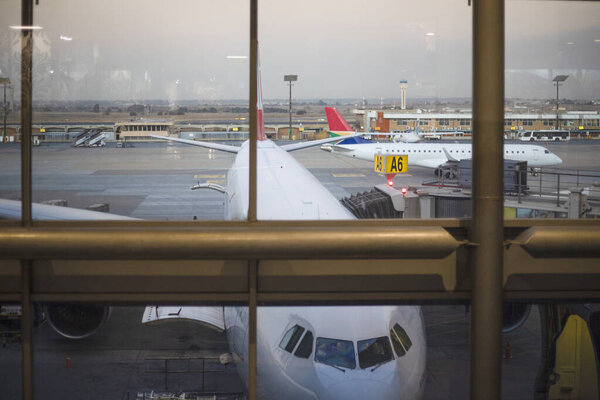 Jet aircraft at the boarding gate of Johannesburg International Airport in South Africa, the best airport in the African continent.