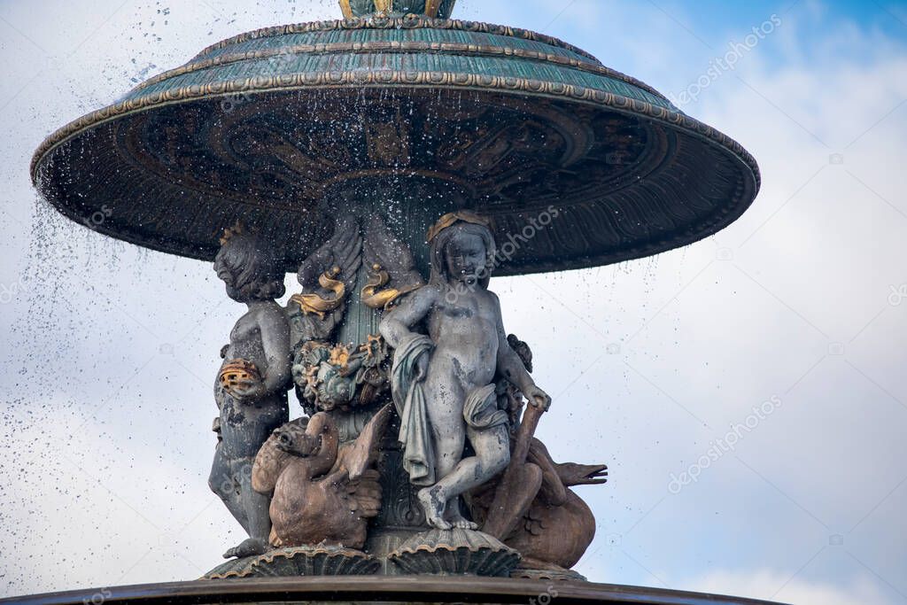 The angelic ornaments of the fountain of the seas of the Place of Concorde in Paris (France) is one of the oldest squares of France and is located next to the ancient Egyptian obelisk.