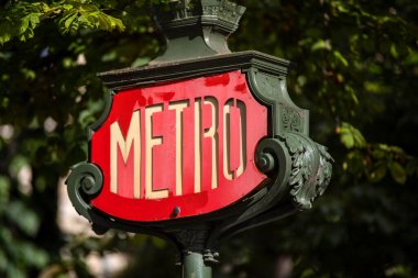 Metro sign of the French city of Paris, metro that runs throughout the city along the Seine River, this beautiful sign is located near the Place of Concorde in Paris.