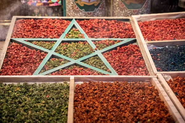 Moroccan flag with spices in the streets of Marrakech where there are many Arab stores, it is a very touristic place in Morocco.