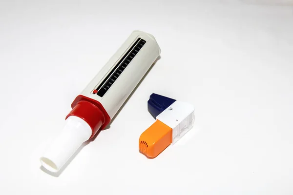 Pharmaceutical product is used to treat or prevent asthma attack. Health and medical concept. Asthma inhalers for asthma and COPD patients. Peak Flow Meter.