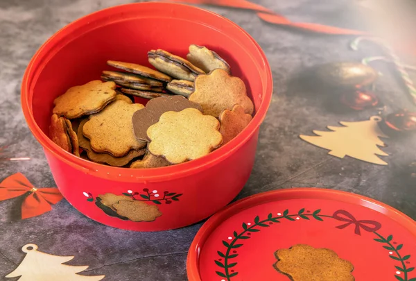 Christmas cookies, brown cookies in a red box and christmas decoration.