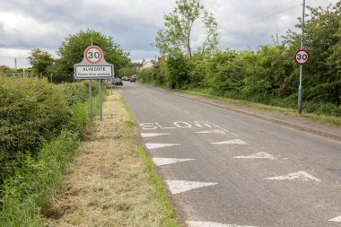 Thirty mile per hour street sign with village name